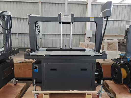 Qualité  Semi-Automatic 1200mm Carton Box Strapping Machine with One Year Warranty for Efficient Packing Usine